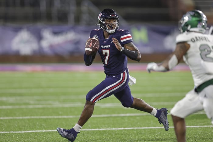 Liberty Flames quarterback Malik Willis (7) rolls out to pass against the Eastern Michigan Eagles in the third quarter during the 2021 LendingTree Bowl at Hancock Whitney Stadium.
